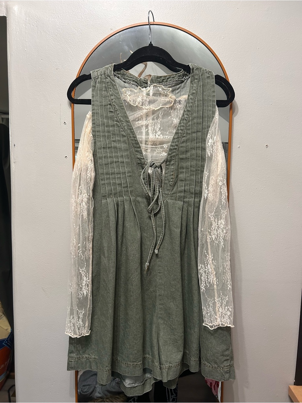 green oversized romper and lace top
